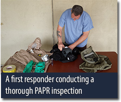 A first responder conducting a thorough PAPR inspection